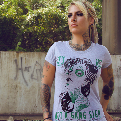 Like most T-shirts, the one this girl is wearing has a
knit band at the neck opening Like most T-shirts, the one this girl is wearing has a knit band at the neck
opening.